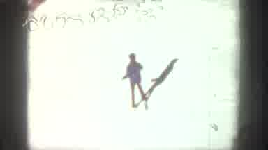Aspen Colorado USA (1961): Several People Skiing Downhill On A Bright Sunny Winter
