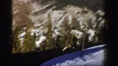 Aspen Colorado USA (1961): Panning Shot Of Person Riding Down A Snowy Hill In The