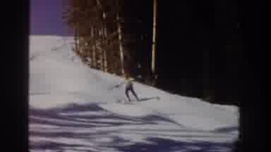 Aspen Colorado USA (1961): Person Skiing Down Snow-Covered Slope On Clear Day