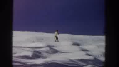 Aspen Colorado USA (1961): Man On Skis Skiing Down Snow Covered Hill In Winter