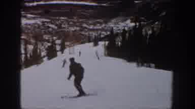 Aspen Colorado USA (1961): Dark Video Of Some People Skiing Down Hill During A