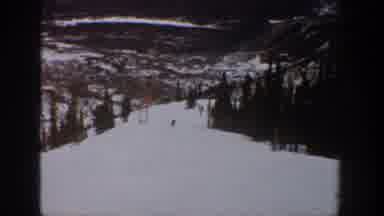 Aspen Colorado USA (1961): People Skiing Down A Snow Covered Hill