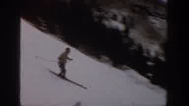 Aspen Colorado USA (1961): Skiers Take Turns Descending A Mountain's Slopes Which