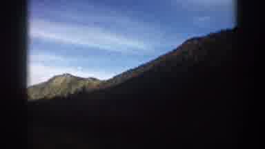 Aspen Colorado USA (1961): A Vehicle Passes Through A Valley In The High Desert