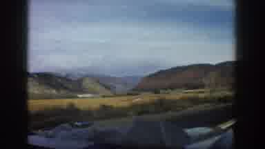 Aspen Colorado USA (1961): Vehicle Runs Across Road Following Spectacular Nature