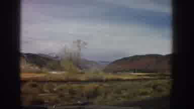 Aspen Colorado USA (1961): Driving In A Car Looking Out At Hills And Shrubs