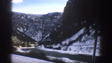 Aspen Colorado USA (1961): Driving On A Road Through The Mountains Filled With