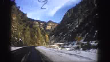 Aspen Colorado USA (1961): Driving Up A Mountain Highway In Winter With Snow On