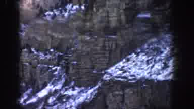 ASPEN COLORADO USA-1961: Snow-Dusted Cliffs And Rugged Mountain Terrain