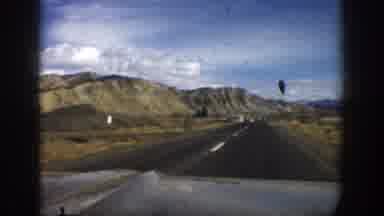 Aspen Colorado USA (1961): Driving Down Road With Mountain Landscape In The