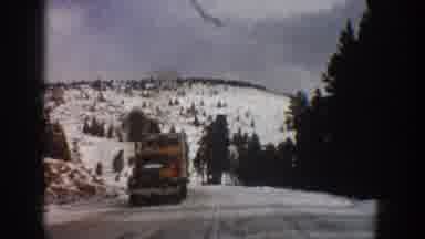Aspen Colorado USA (1961): A Vehicle Traveling A Snow-Covered Road In The