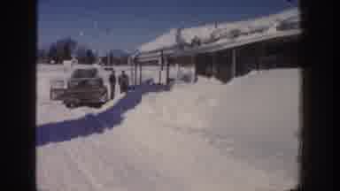 Aspen Colorado USA (1961): People Leaving A Snowed In House To Get Into Their Car