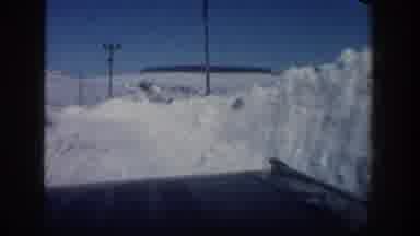 Aspen Colorado USA-1961: Driving On A Frozen Ice Road With Power Poles