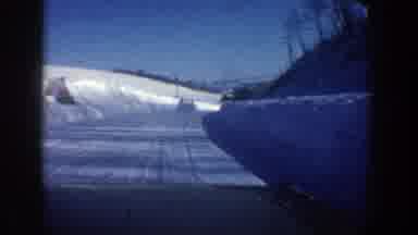 Aspen Colorado USA (1961): Car Drives Down Snowy Road And Cruises Through Northern