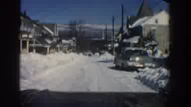 Aspen Colorado USA (1961): Car Driving In A Town Full Of Snow In Winter