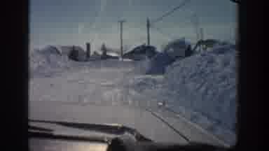 Aspen Colorado USA (1961): Driving Slowly Down The Road In The Snow During The Day