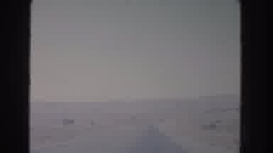 New Mexico USA (1951): Driving Down A Snowy Highway No Other Traffic