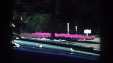 California USA (1952): Person Driving Along In A Highway In An Old Car By A Lake