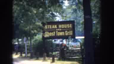 California USA (1952): A Large Group Of People Are Heading To A Steakhouse Near A
