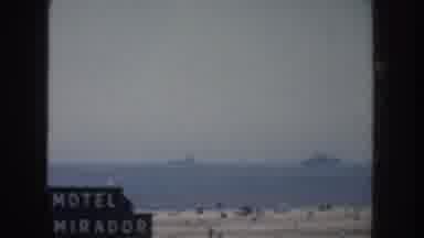California USA (1952): People At Beach Resort Gathered To Watch Something, With