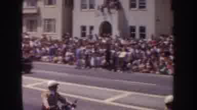 California USA (1952): A Crowd Of People Of Side Of Road Watching People Drive