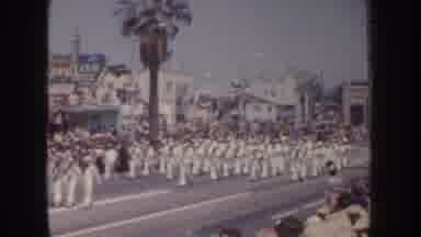 California USA (1952): People Dressed In White Uniforms Marching Down The Street