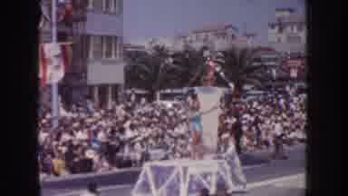 CALIFORNIA USA-1952: Woman In Swimsuit On Float Waving At Crowd During Parade