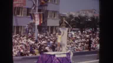 California USA (1952): Woman Wearing Yellow Standing On Purple Parade Float,