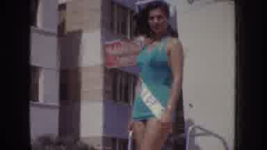California USA (1952): Grecian Pageant Queen In Green Riding On Parade Float