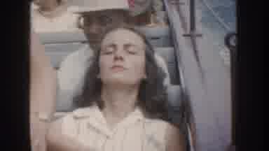 California USA (1952): A Young Lady, Apparently Sleeping, Smiles While Enjoying A
