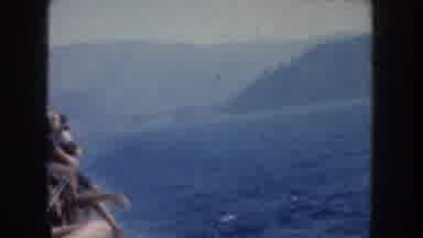 California USA (1952): Many People Boating On Calm Sea With Hills In The