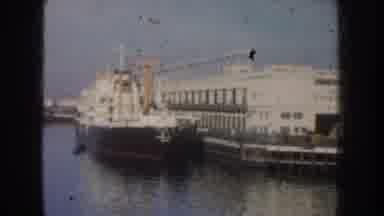 California USA (1952): Large Shipping Boats Docking At A Marina In The Daytime