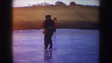 North Dakota USA (1953): A Couple Ice Skating In Tandem And The Female Slips And