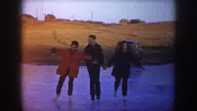North Dakota USA (1953): Three Friends And A Dog Skate On A Frozen Pond