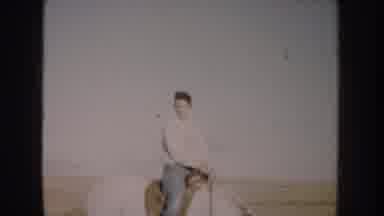 South Dakota USA (1953): Woman Riding A Dark Brown And White Horse In A Wide Open