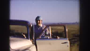 South Dakota USA (1953): Woman With Green Hat Getting Out Of Car Man Starting Old