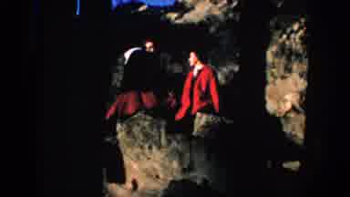 SOUTH DAKOTA USA-1953: Two Gentlemen in Red Coats Standing on Rocky Terrain