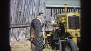 South Dakota USA (1953): A Man With His Old Yellow Tractor