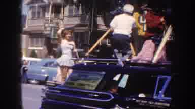 South Dakota USA (1954): View Of Woman Waving From Back Of Car And Marching
