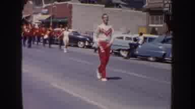 South Dakota USA (1954): Parade With A Marching Band And Drummers Through A Small