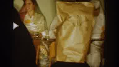 South Dakota USA (1954): People Wearing Yellow Bag Over Heads Sitting In Chairs