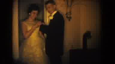 South Dakota USA (1954): A Man Putting A Flower Onto A Woman's Dress For A Formal