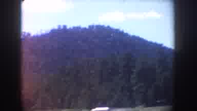 South Dakota USA (1954): Cars Parked Near Mountains And Forest Followed By A