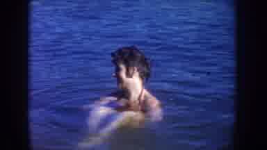 South Dakota USA (1954): Family Fun In The Open Water With Mom Sitting And Son