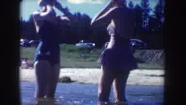 South Dakota USA (1954): Two Girls Run And Stand In The River With Happiness
