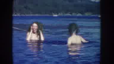 South Dakota USA (1954): Three Women Splashing In Lake Water On A Clear Sunny Day