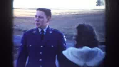 Idaho USA (1955): Man In Military Uniform And Woman Looking At Burros Walking