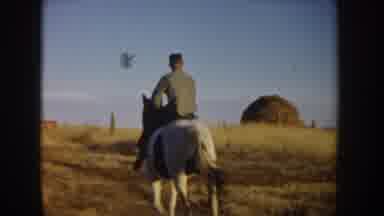 Idaho USA (1955): A Man Slowly Riding A Horse And Then A Women Quickly Riding