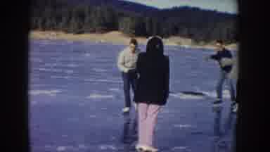 Idaho USA (1955): People Ice Skating On A Frozen Lake During Winter Time