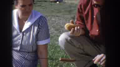 Idaho USA (1955): Group People Eating Food At Picnic On Grass Field Outside Near